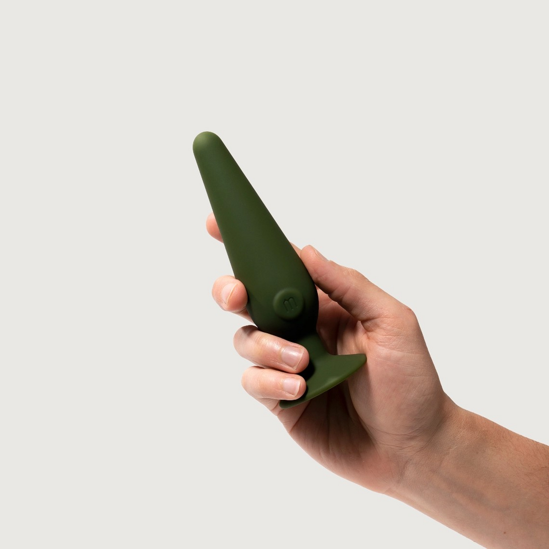  Image of a hand holding the Maude medium cone vibrating plug.