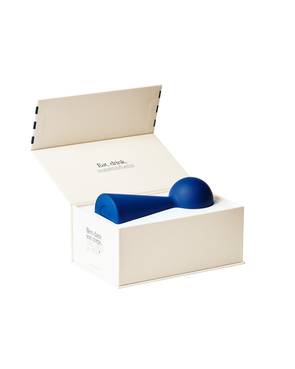 Puissante Bisou vibrator in blue and packed in a beautiful blue striped box.